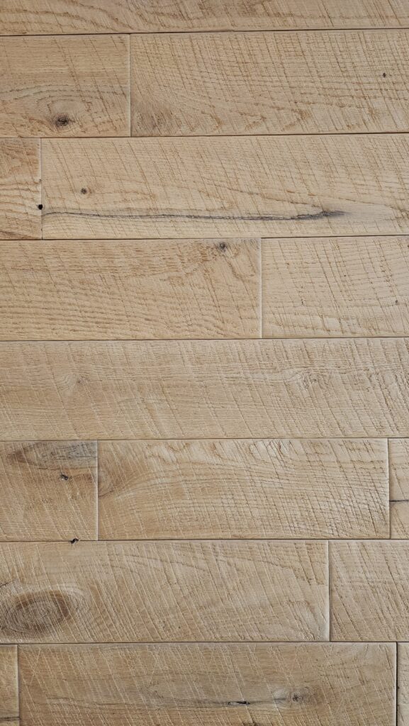 End-matched circle-sawn white oak tongue-and-groove paneling with staggered end joints